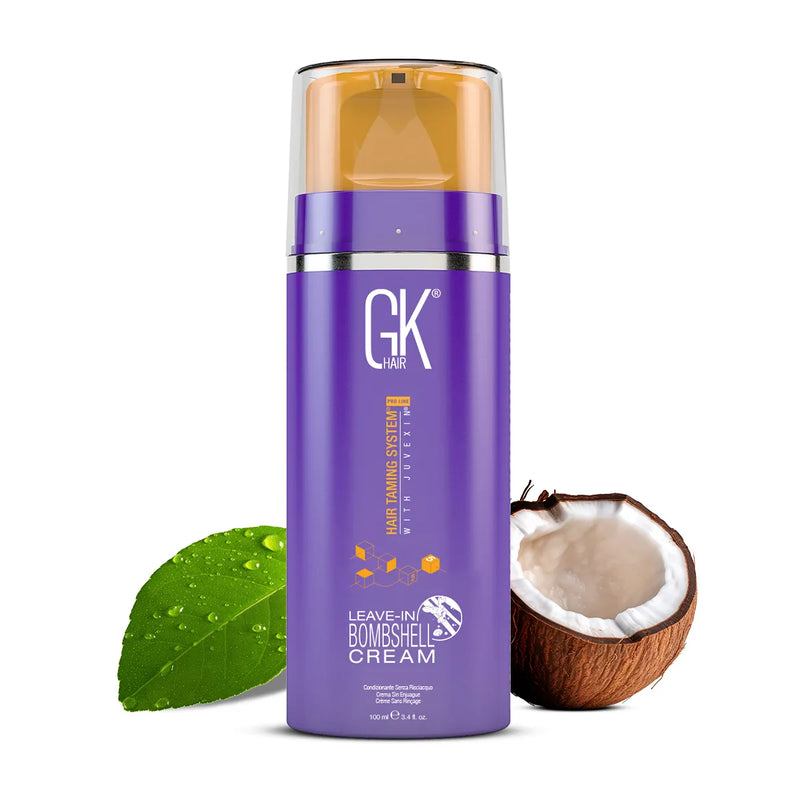 GK Hair Leave-In Bombshell Cream 100 ml purple pump bottle between a dewy green leaf and half a coconut