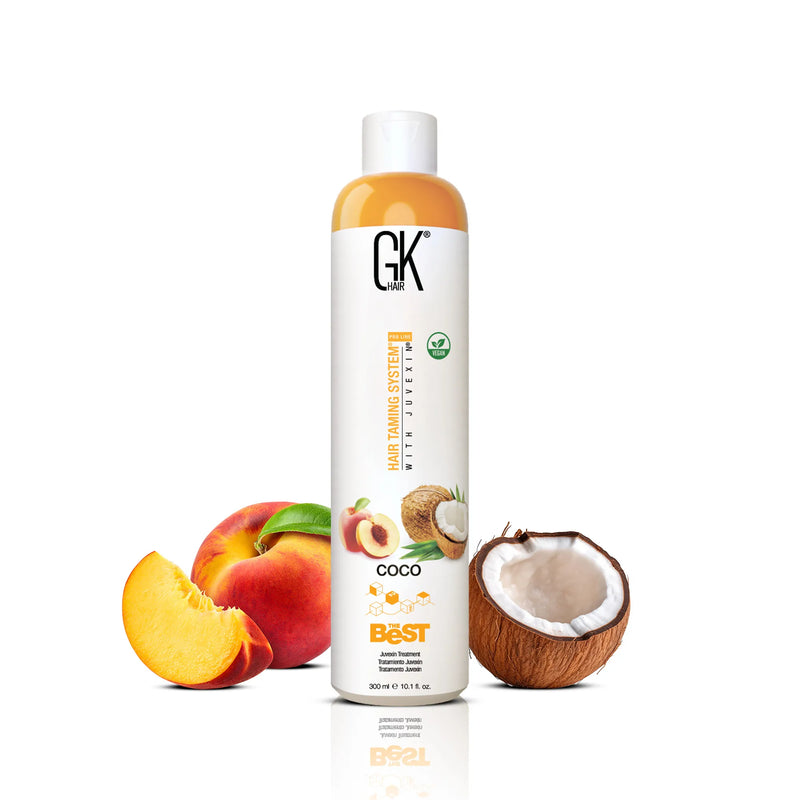 GK Hair The Best Coco 300 ml bottle of amber treatment with a white cap, with a peach, a peach slice and a coconut half