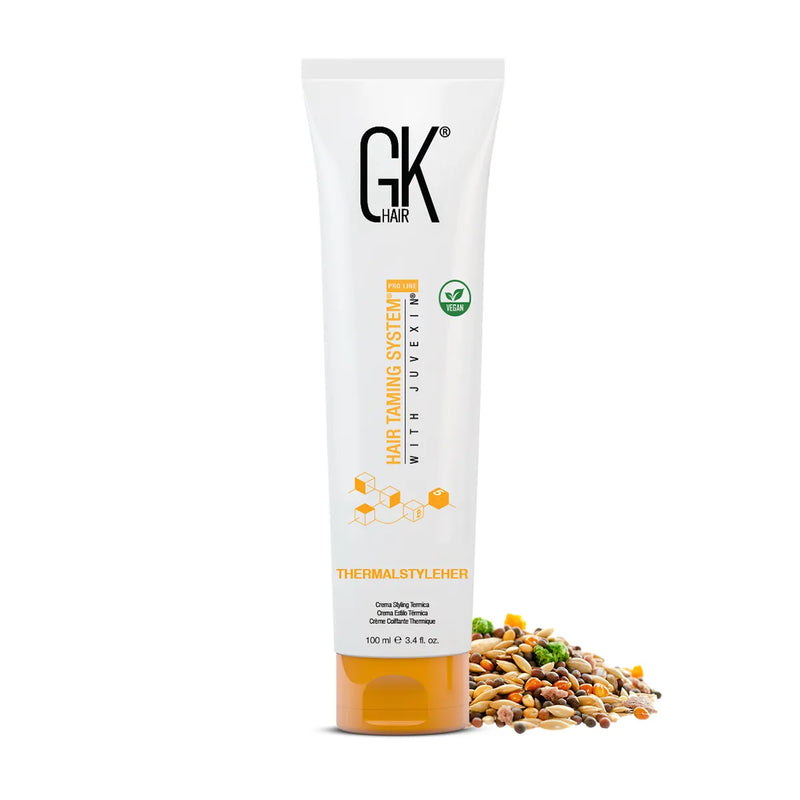 GK Hair ThermalStyleHer Cream 100 ml white tube with orange cap and vegan badge, seed and grain mix piled beside it