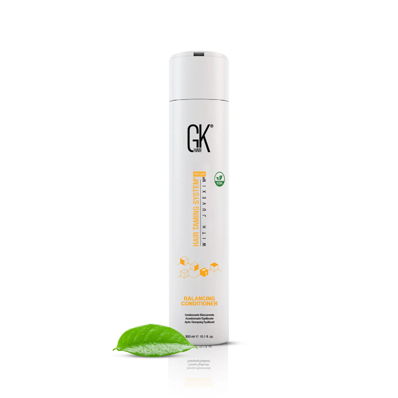 GK Hair Balancing Conditioner 300 ml white flip-cap bottle with a vegan badge, a green leaf resting at its base