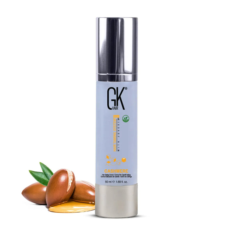GK Hair Cashmere Hair Styling Cream 50 ml pale blue pump bottle with silver cap and vegan badge, argan nuts and oil beside it