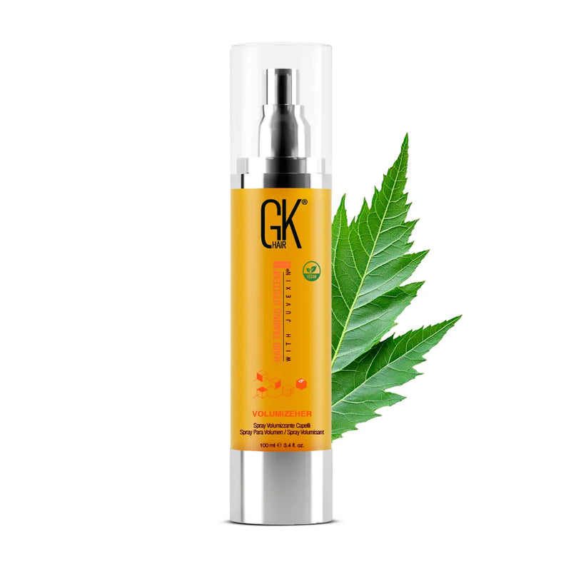 GK Hair VolumizeHer Volumizing Spray 100 ml gold and silver airless pump bottle with a vegan badge, beside a green leaf
